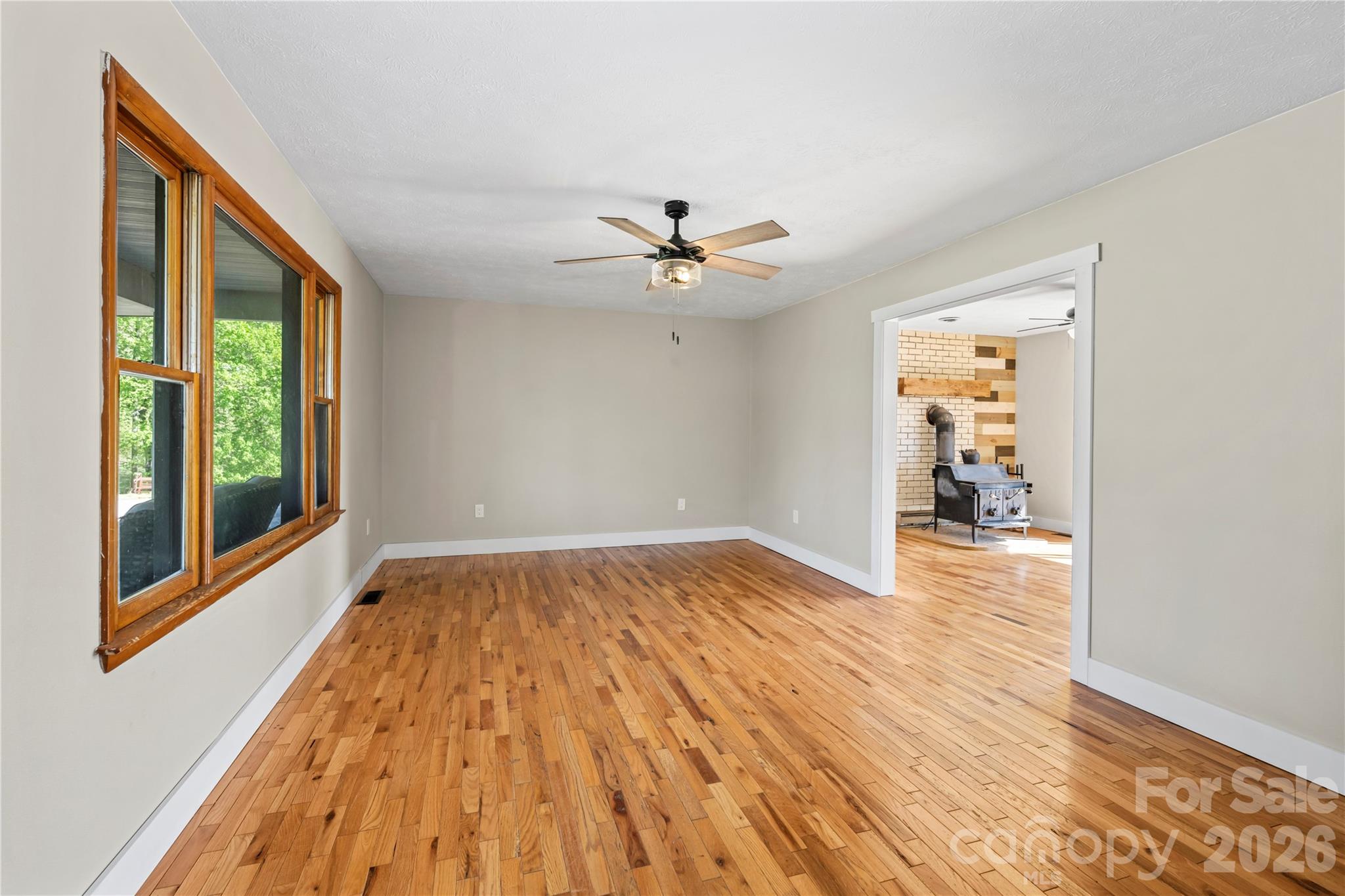 882 Queentown Road Canton, NC 28716 - Photo 10 of 33 wooden floor in an empty room with a window
