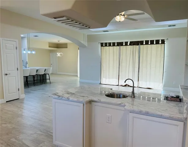 a kitchen with stainless steel appliances granite countertop a sink and a counter space