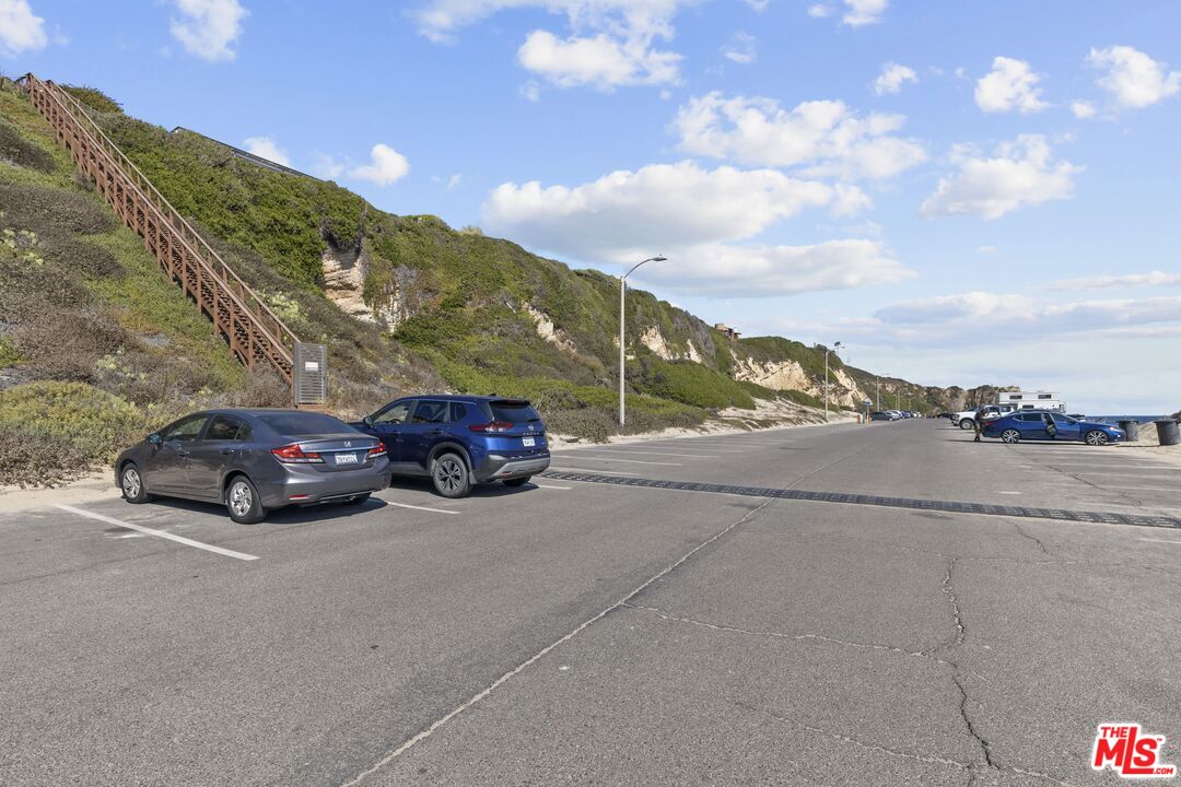 7263 Birdview Avenue Malibu, CA 90265 - Photo 15 of 17 a view of a car parking lot of a road