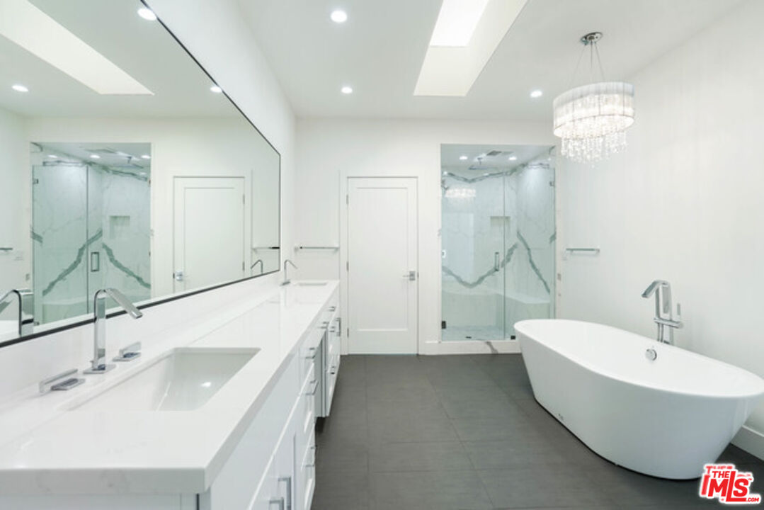 7263 Birdview Avenue Malibu, CA 90265 - Photo 9 of 17 a bathroom with a sink and a tub