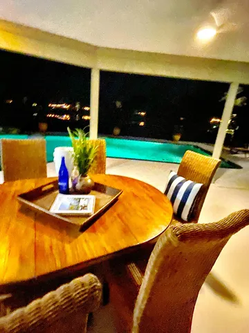 a view of swimming pool with seating space