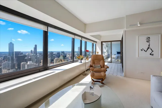 a room with furniture and a large window