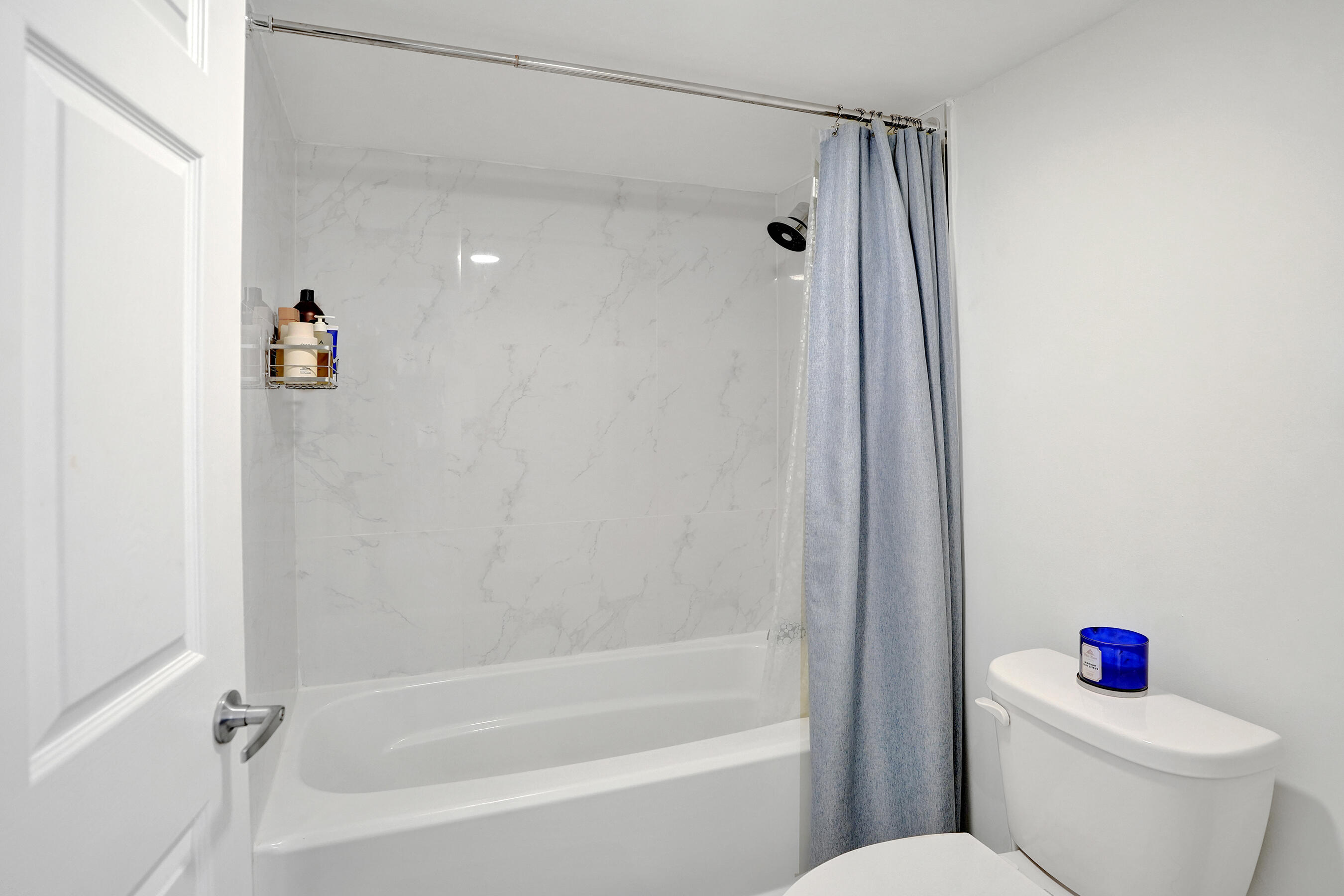 3237 Clint Moore Road, Unit 108 Boca Raton, FL 33496 - Photo 23 of 35 a bathroom with a shower and a toilet