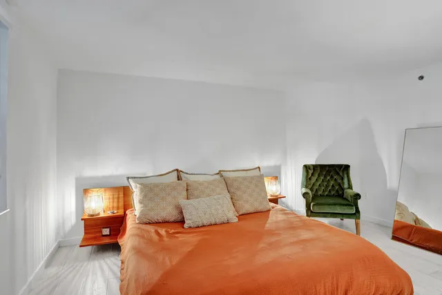 a bathroom with a shower curtain and a window