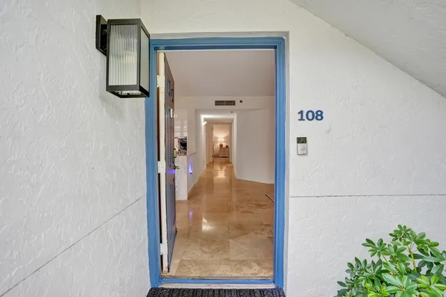 a kitchen with cabinets and chairs