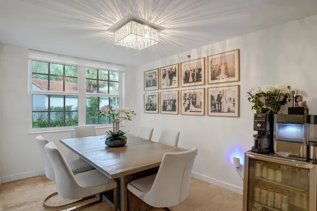 a dining room with furniture and chandelier