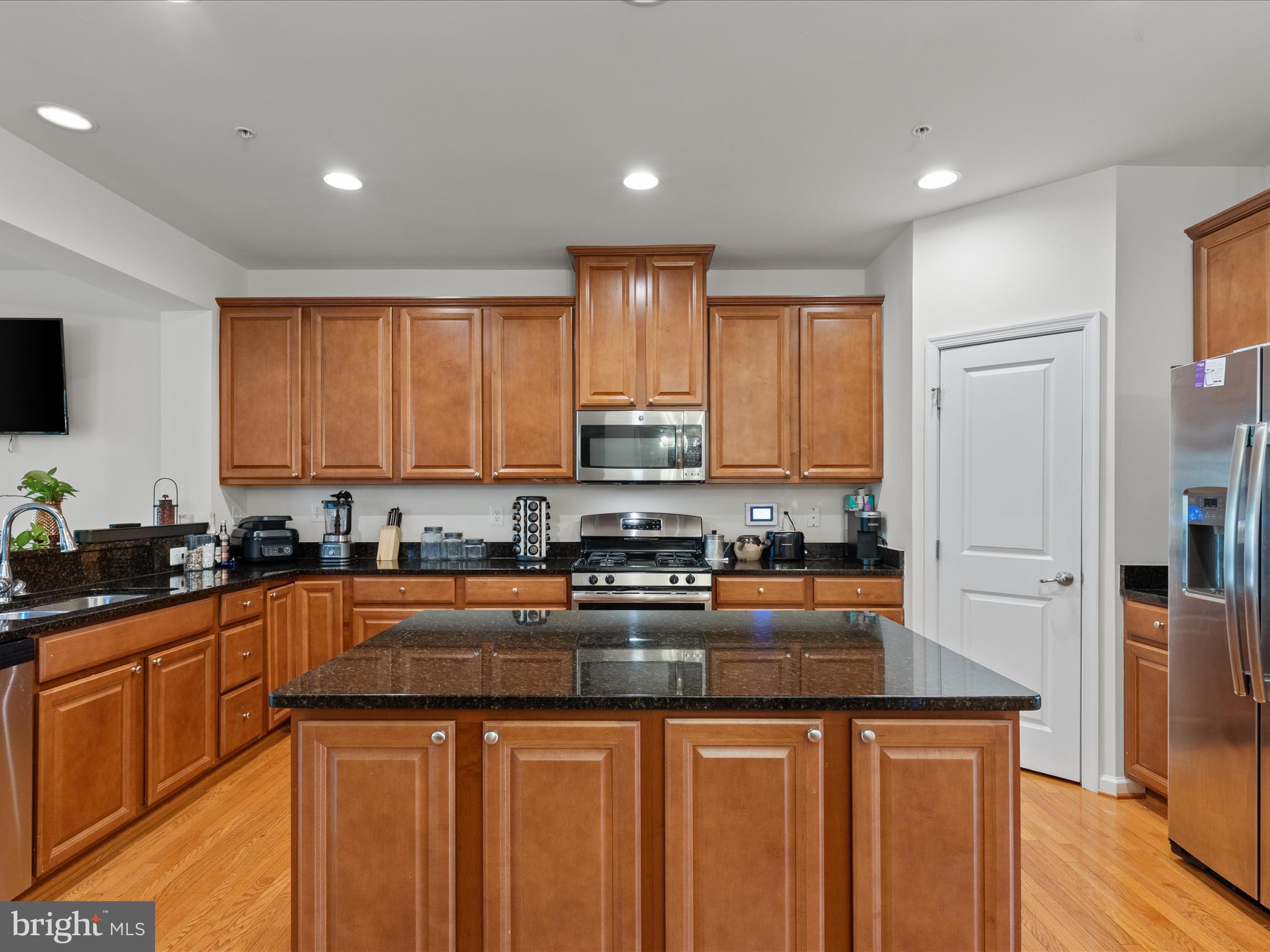 2804 St Marys View Road Accokeek, MD 20607 - Photo 13 of 37 a kitchen with stainless steel appliances granite countertop a stove a sink a refrigerator and cabinets