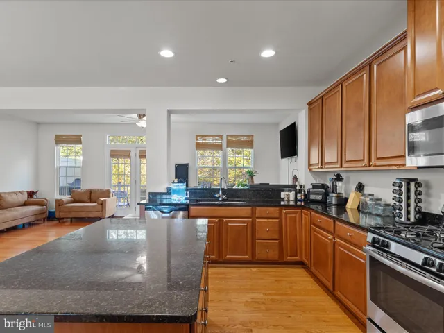 a large kitchen with lots of counter space sink and a stove