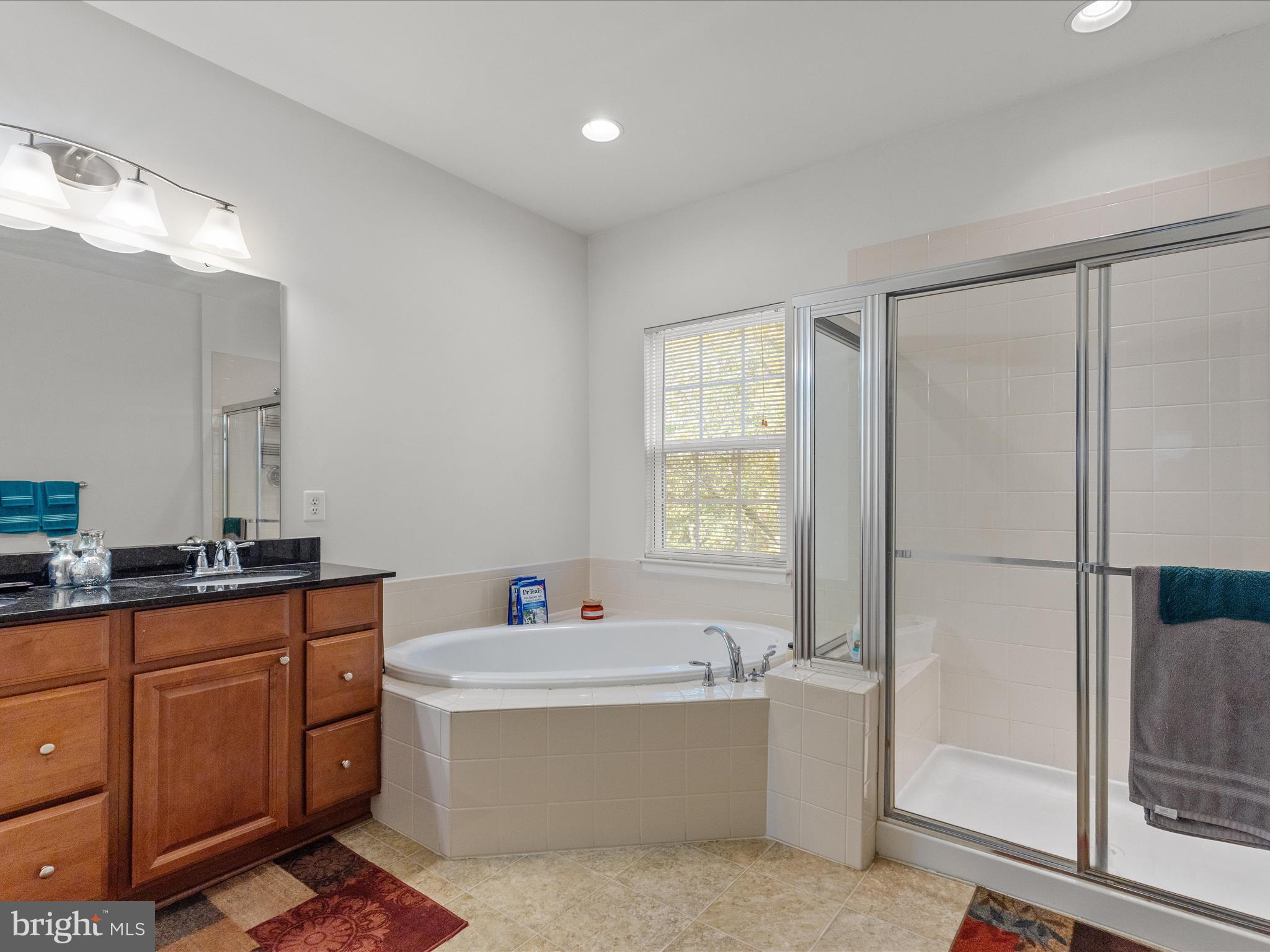 2804 St Marys View Road Accokeek, MD 20607 - Photo 29 of 37 a bathroom with a tub sink and mirror