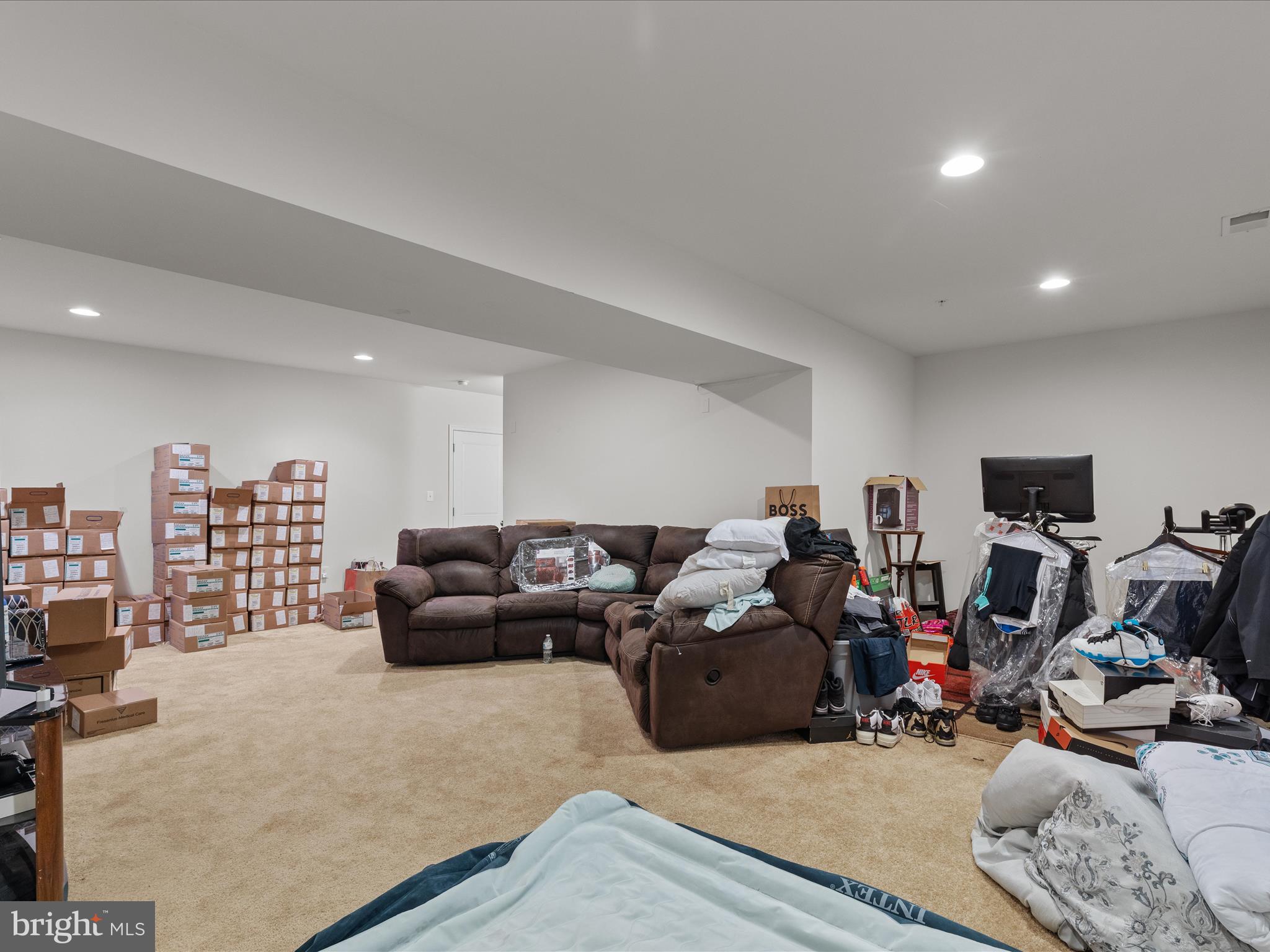 2804 St Marys View Road Accokeek, MD 20607 - Photo 35 of 37 a living room with furniture a couch and a flat screen tv