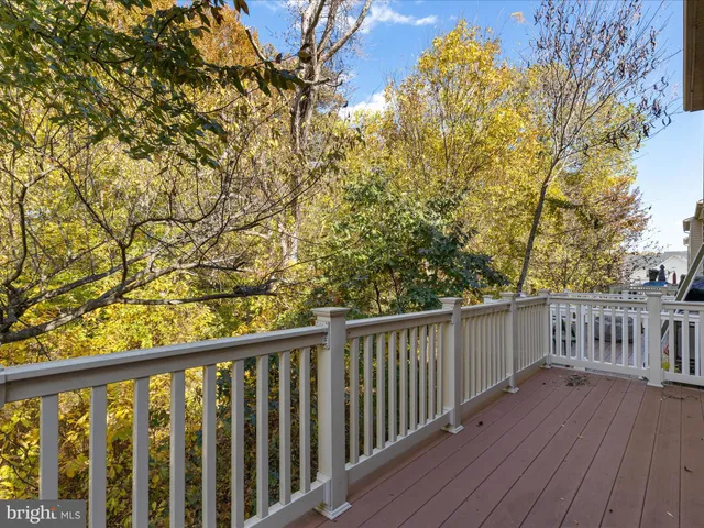 a view of balcony with wooden floor