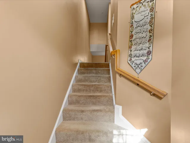 a view of staircase with white walls