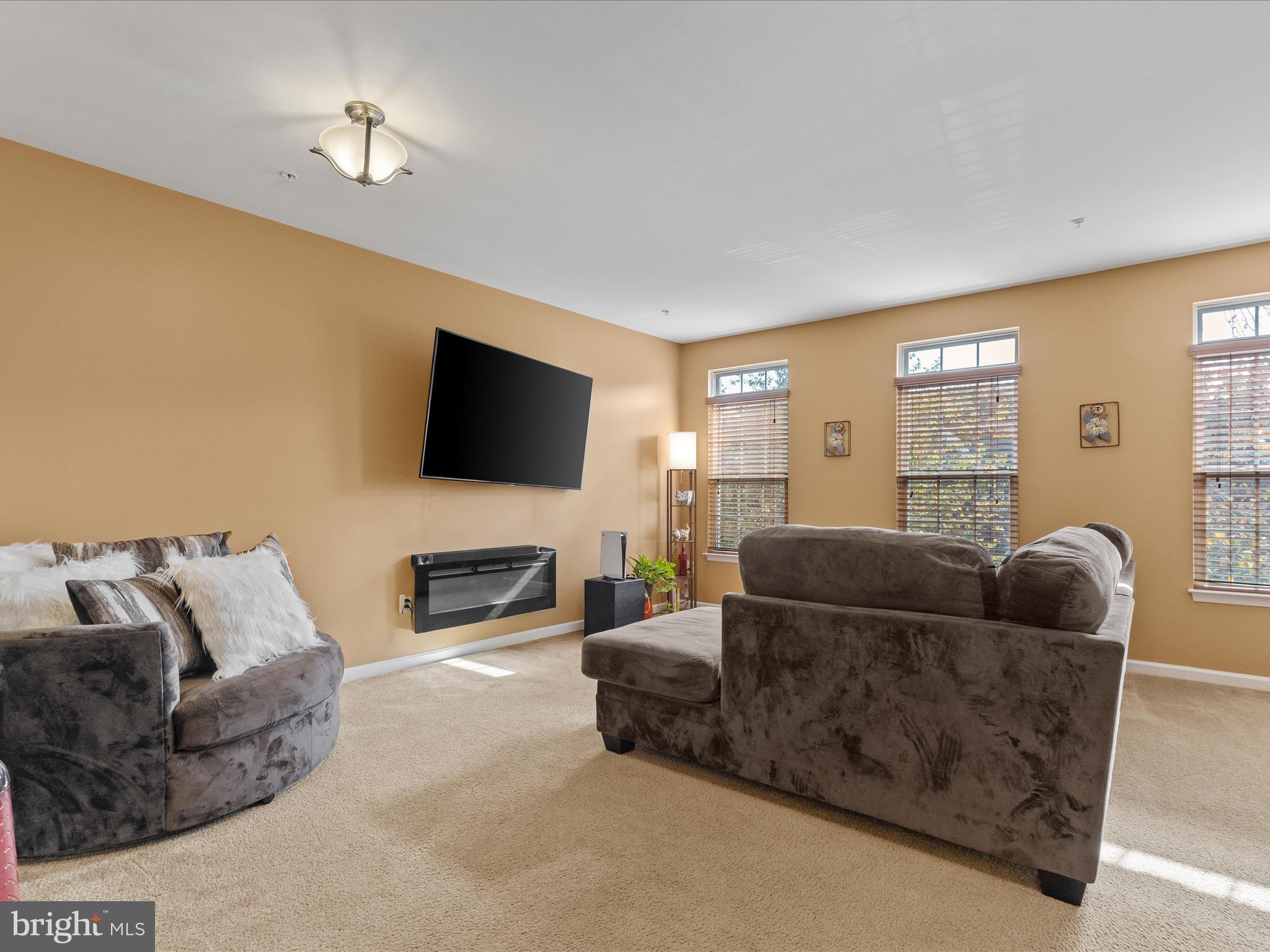 2804 St Marys View Road Accokeek, MD 20607 - Photo 5 of 37 a living room with furniture and a flat screen tv