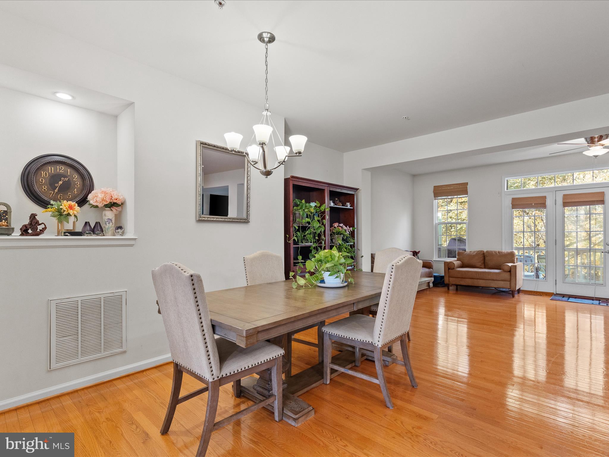 2804 St Marys View Road Accokeek, MD 20607 - Photo 10 of 37 a view of a dining room with furniture a chandelier and wooden floor