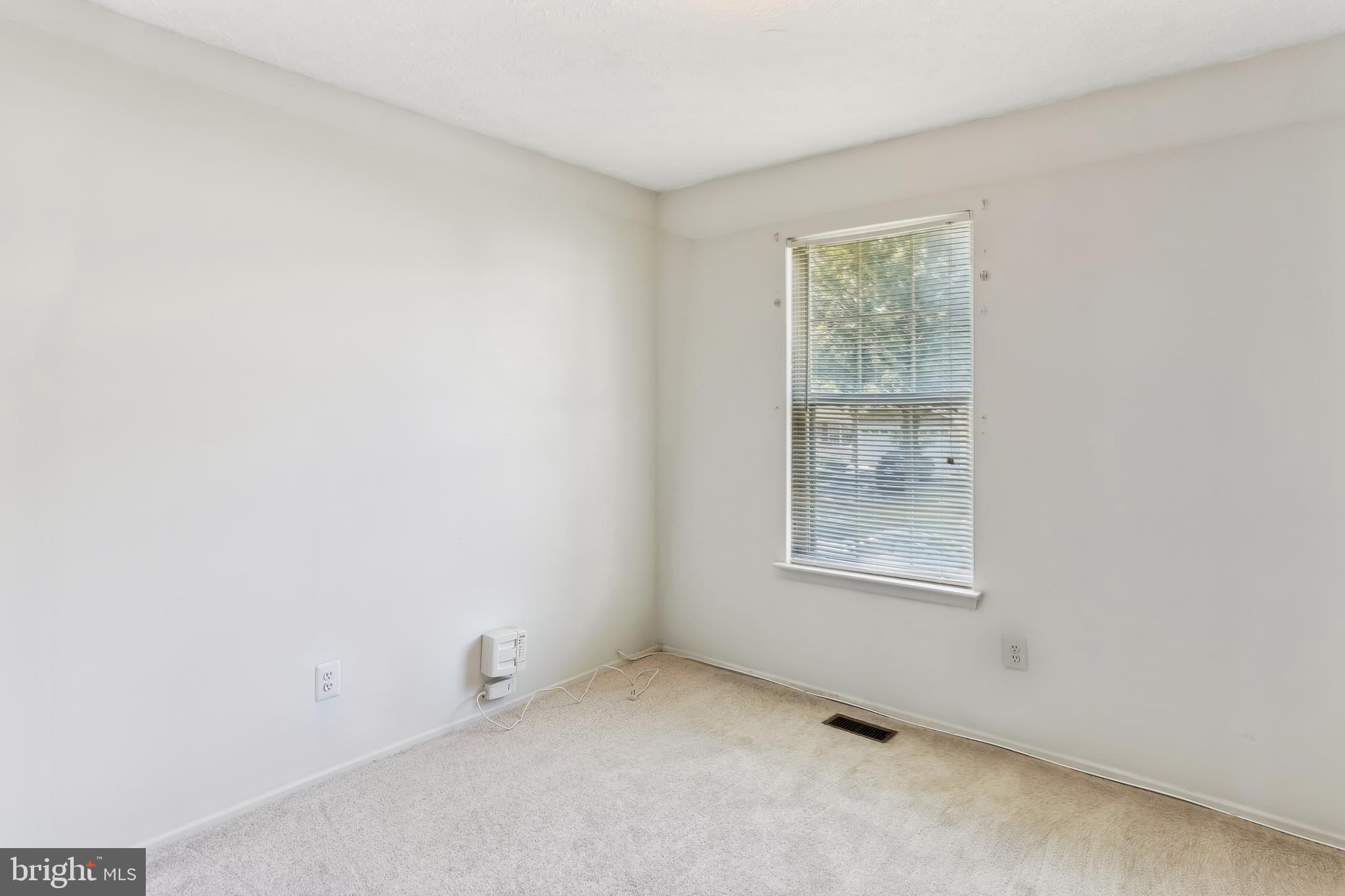 8225 Grainfield Road Severn, MD 21144 - Photo 23 of 35 an empty room with a window
