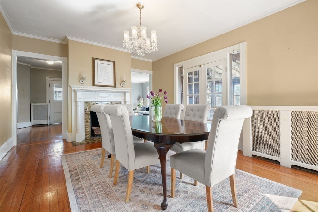 3 Rundel Park Boston, MA 02124 - Photo 12 of 31 a view of a dining room with furniture a chandelier and wooden floor