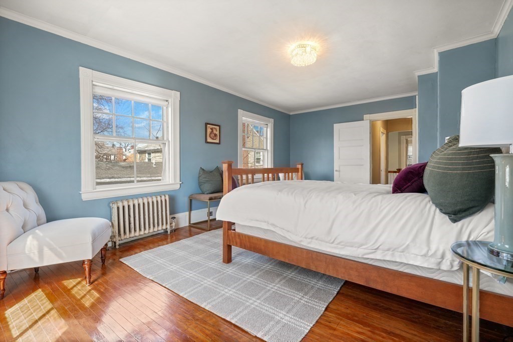 3 Rundel Park Boston, MA 02124 - Photo 21 of 31 a bedroom with a bed a couch chair and a window