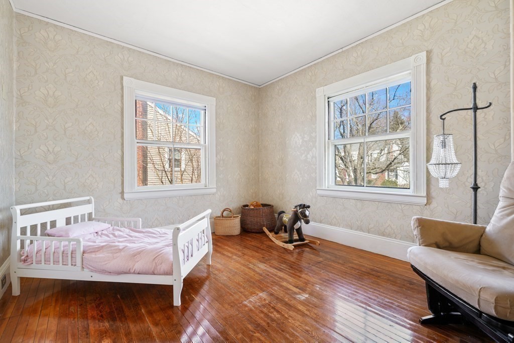 3 Rundel Park Boston, MA 02124 - Photo 23 of 31 a bedroom with a bed and wooden floor