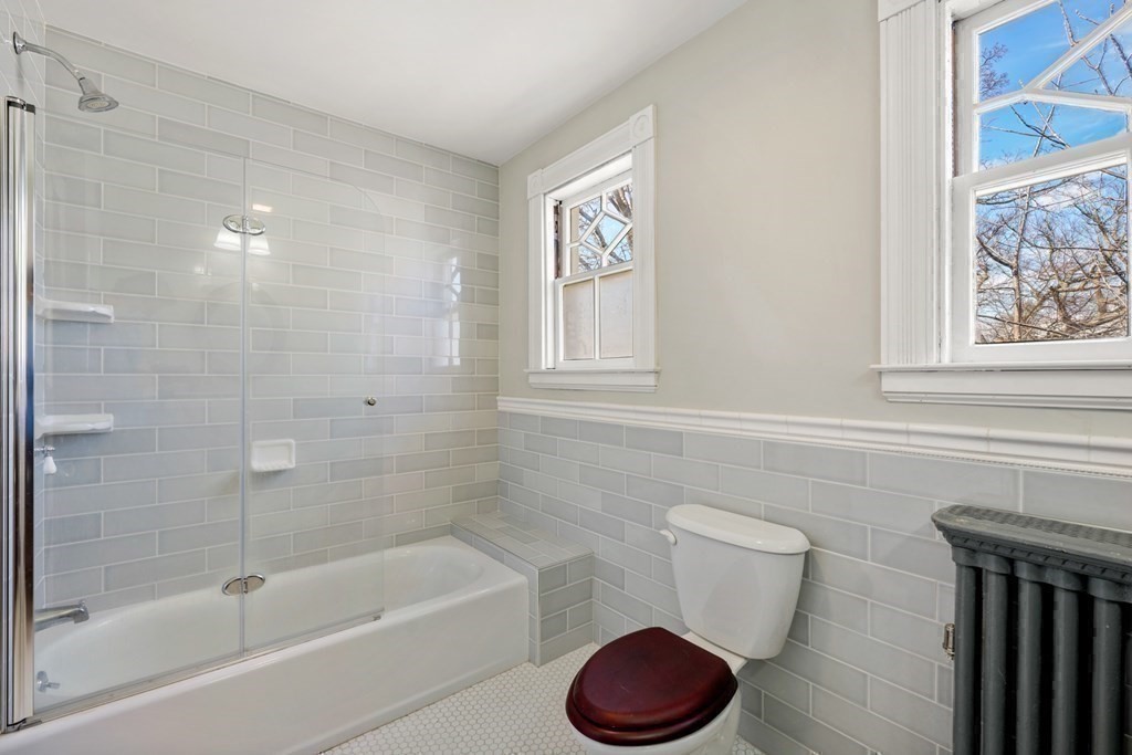 3 Rundel Park Boston, MA 02124 - Photo 26 of 31 a bath room with a toilet and a bath tub