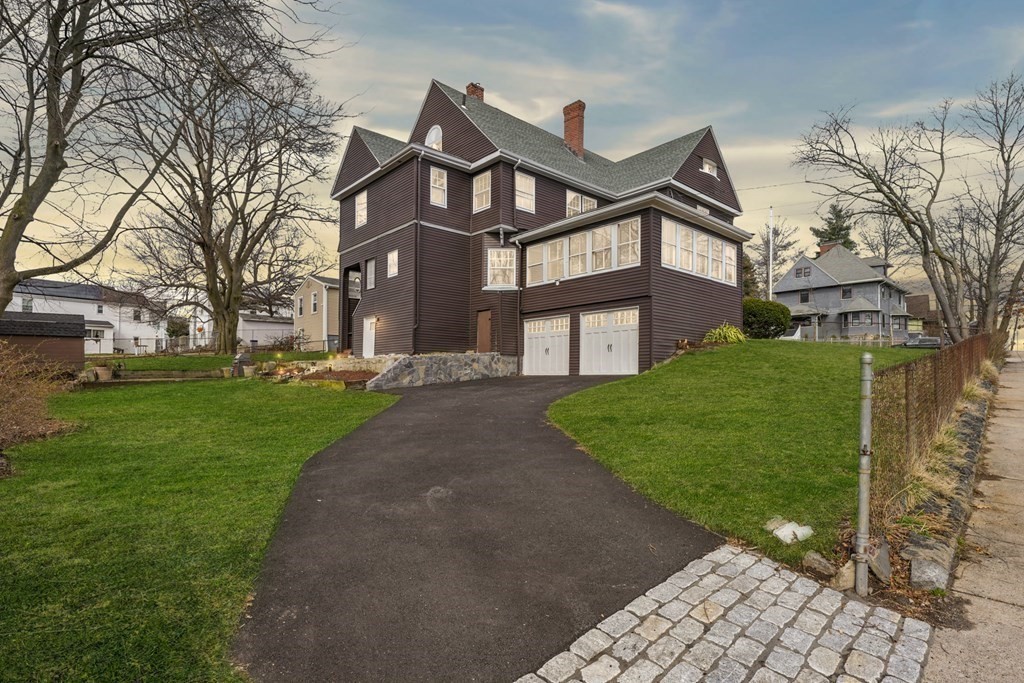 3 Rundel Park Boston, MA 02124 - Photo 3 of 31 a front view of a house with a yard