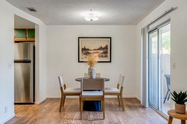 a dining room with furniture and a fireplace