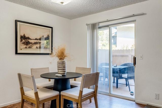 a living room with fireplace furniture and a table