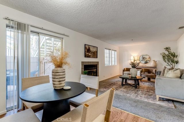 a dining room with furniture a table and chairs