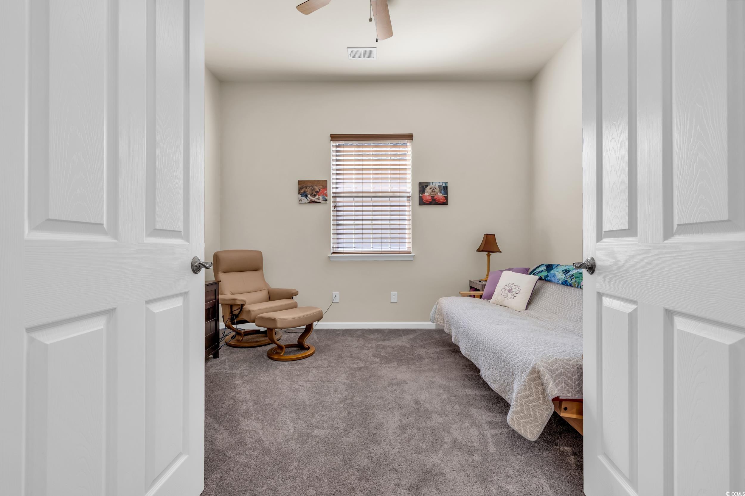 138 Sugar Loaf Lane Murrells Inlet, SC 29576 - Photo 11 of 38 Living area featuring carpet flooring and ceiling