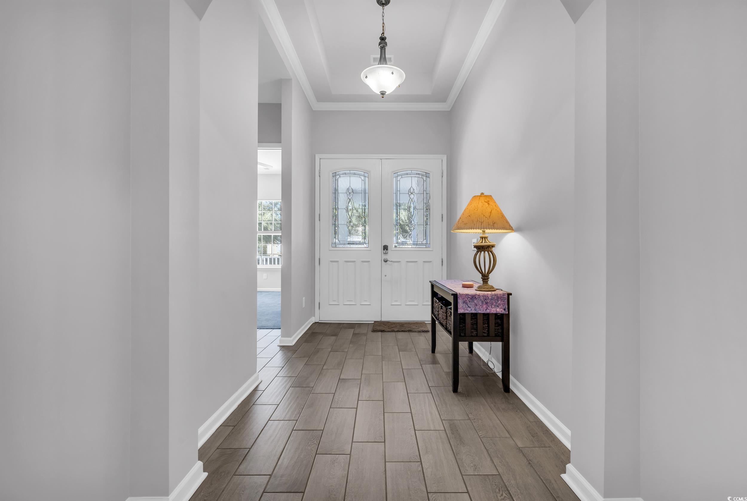 138 Sugar Loaf Lane Murrells Inlet, SC 29576 - Photo 13 of 38 Foyer featuring baseboards, wood tiled floor, and
