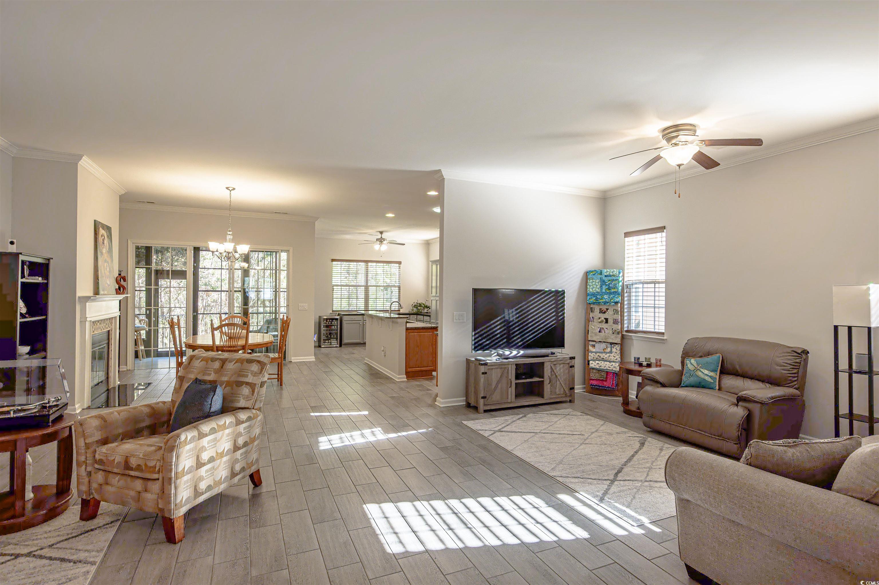 138 Sugar Loaf Lane Murrells Inlet, SC 29576 - Photo 14 of 38 Living room featuring ceiling fan with notable cha