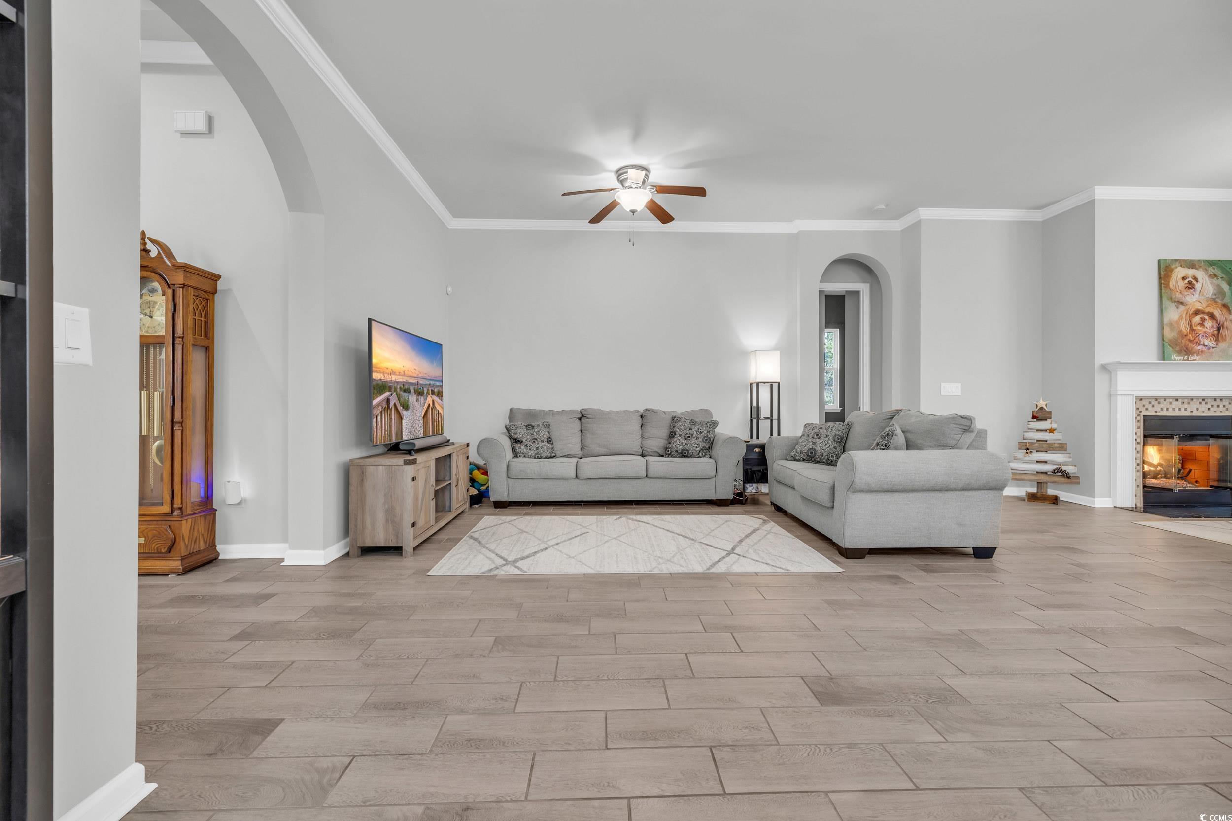 138 Sugar Loaf Lane Murrells Inlet, SC 29576 - Photo 15 of 38 Unfurnished living room featuring arched walkways,