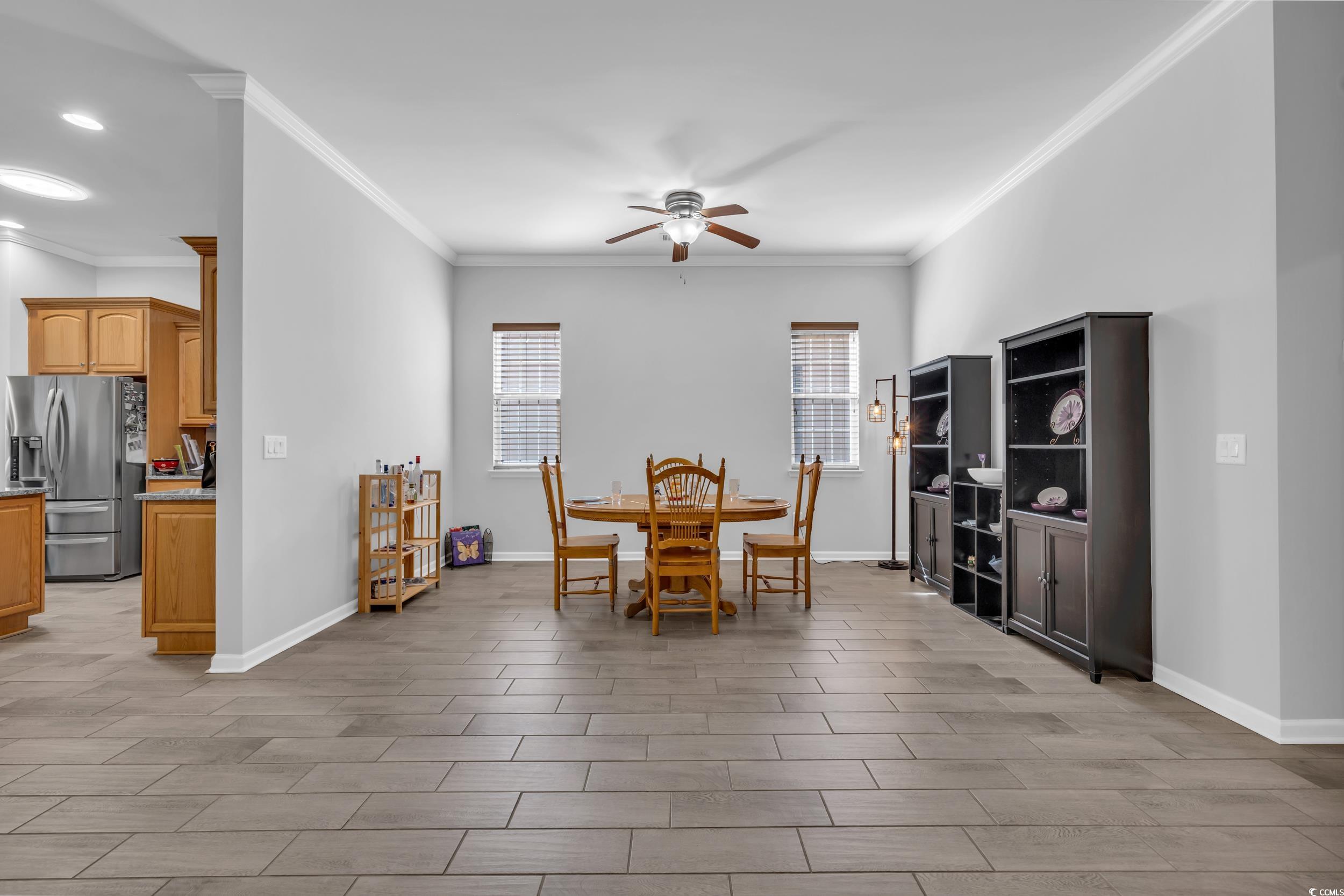 138 Sugar Loaf Lane Murrells Inlet, SC 29576 - Photo 16 of 38 Dining area with ceiling fan and crown molding