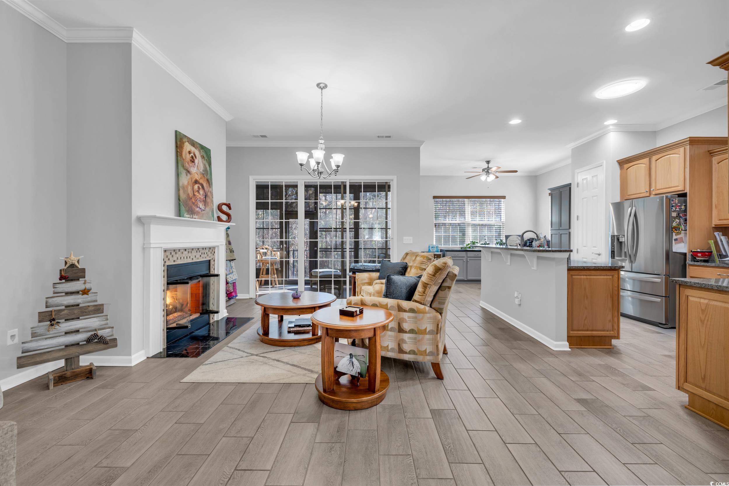 138 Sugar Loaf Lane Murrells Inlet, SC 29576 - Photo 19 of 38 Living area featuring baseboards, light wood-style