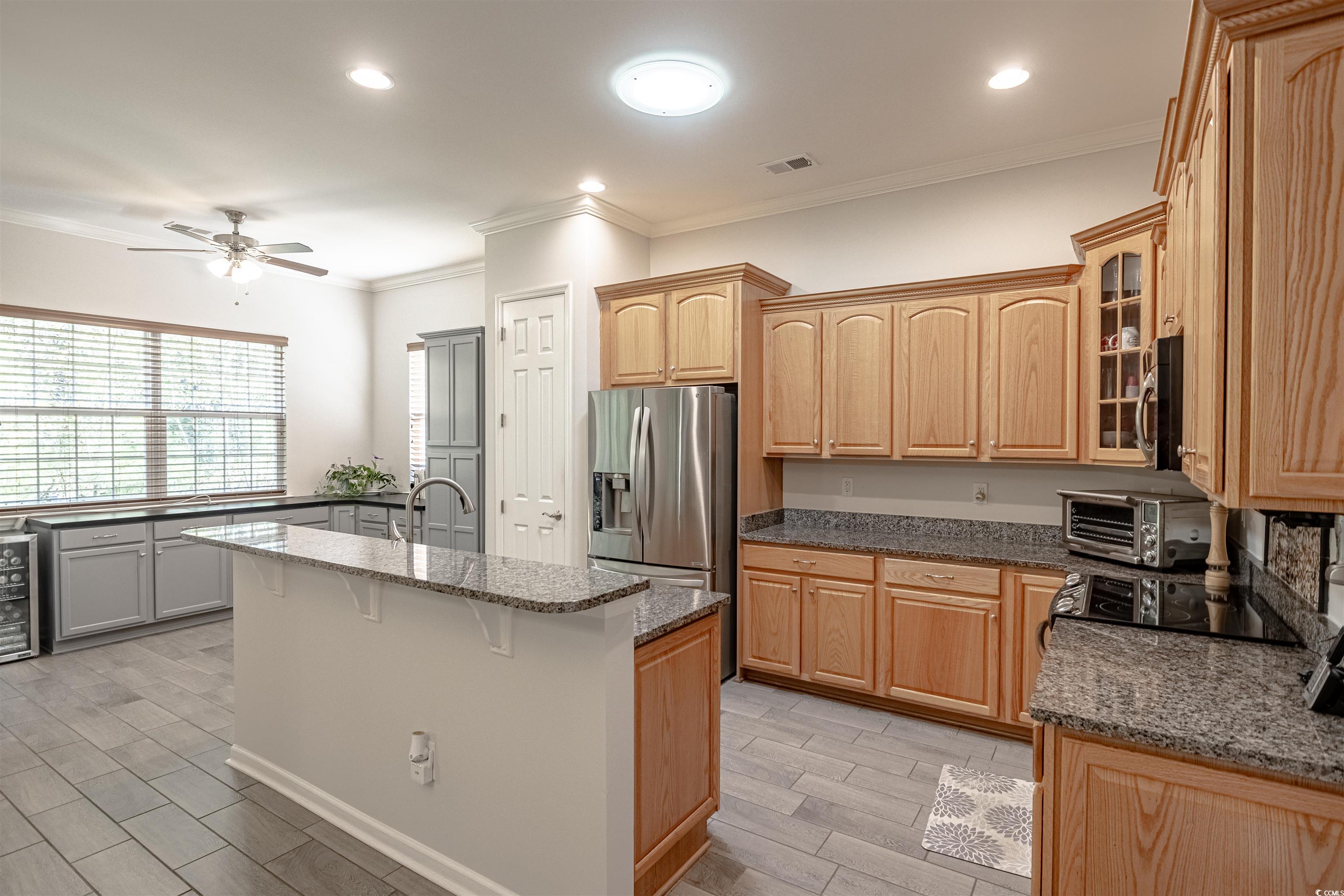 138 Sugar Loaf Lane Murrells Inlet, SC 29576 - Photo 20 of 38 Kitchen with ceiling fan, stainless steel applianc