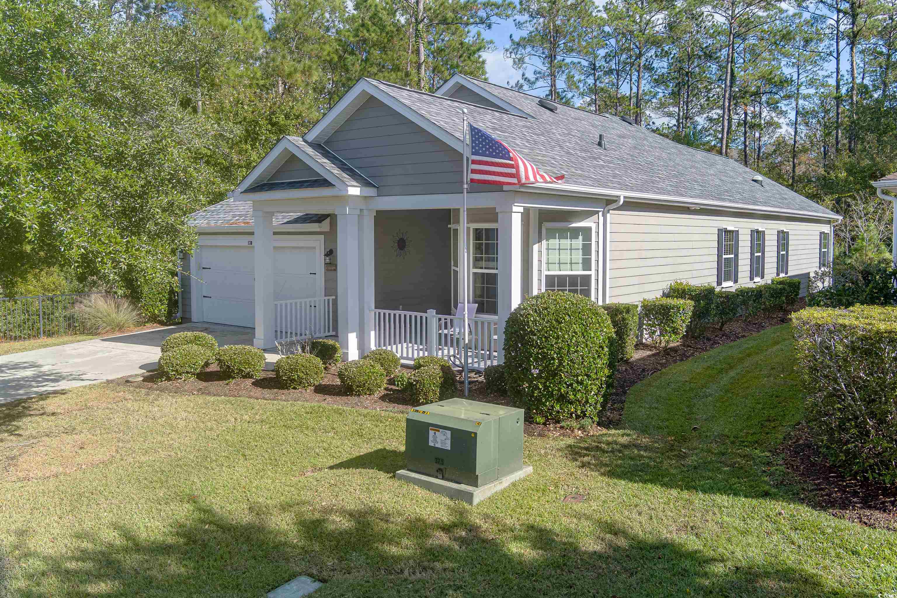 138 Sugar Loaf Lane Murrells Inlet, SC 29576 - Photo 2 of 38 View of front facade featuring covered porch, a ga