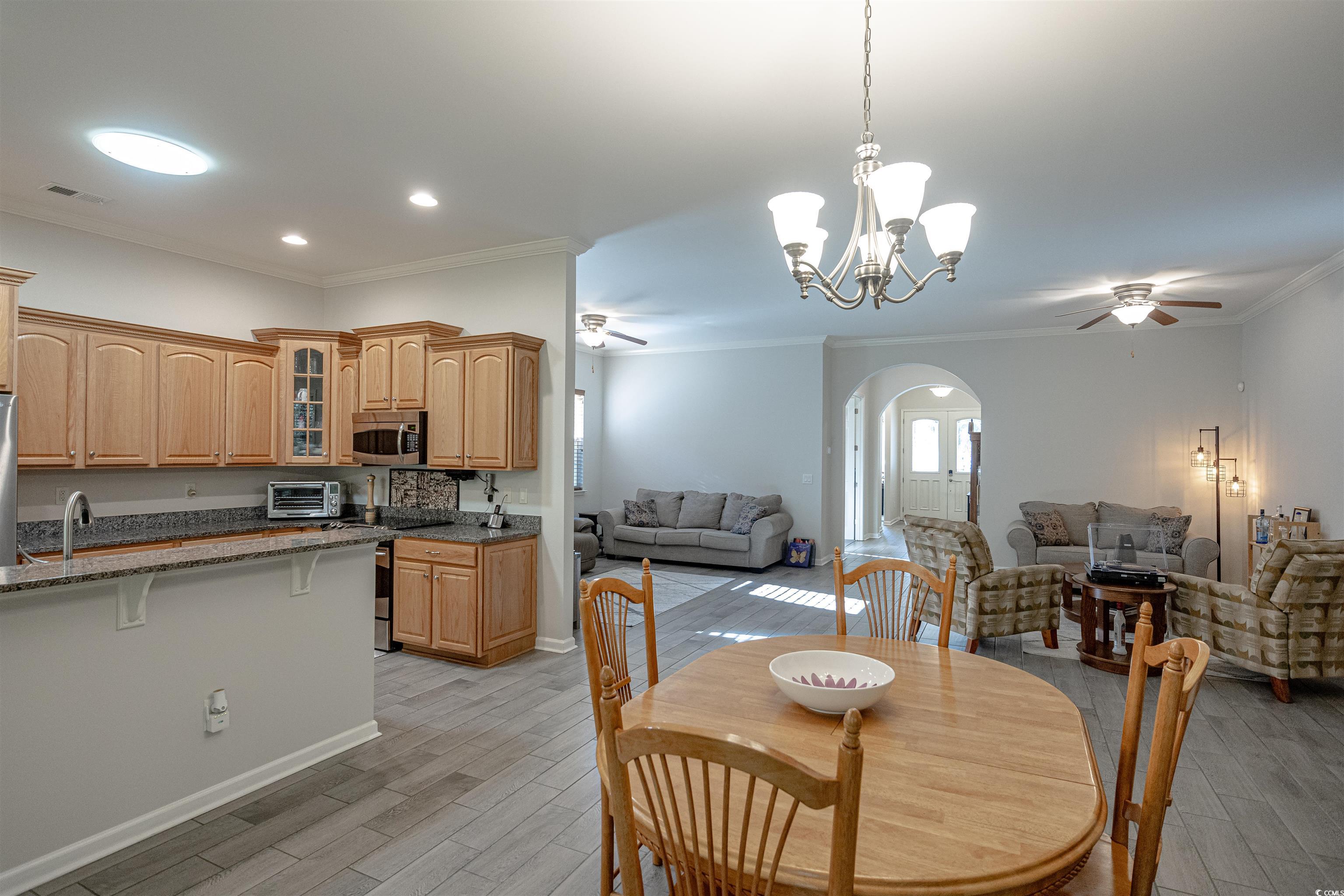 138 Sugar Loaf Lane Murrells Inlet, SC 29576 - Photo 21 of 38 Dining area featuring ceiling fan with notable cha