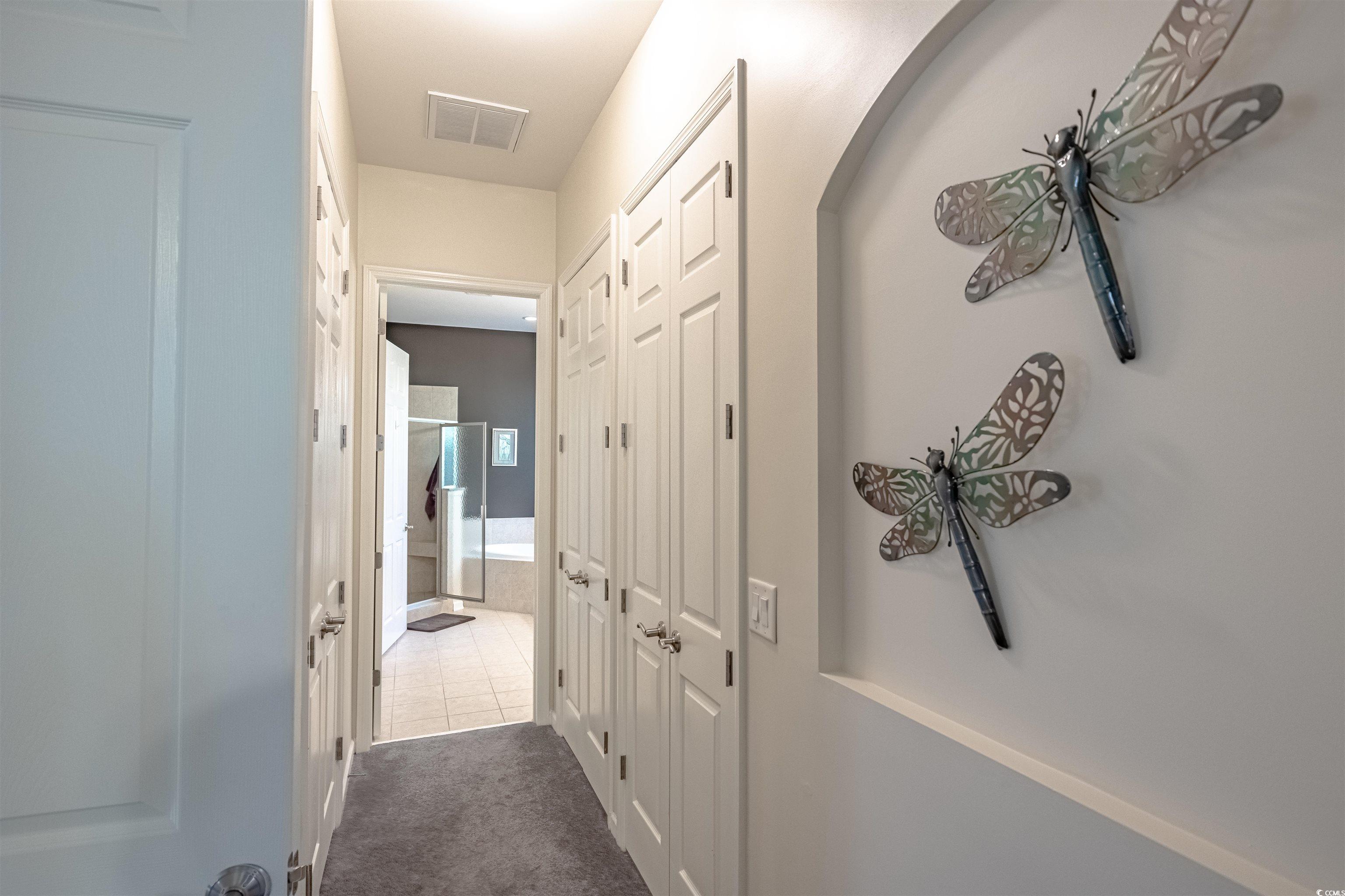 138 Sugar Loaf Lane Murrells Inlet, SC 29576 - Photo 26 of 38 Corridor featuring dark tile patterned flooring
