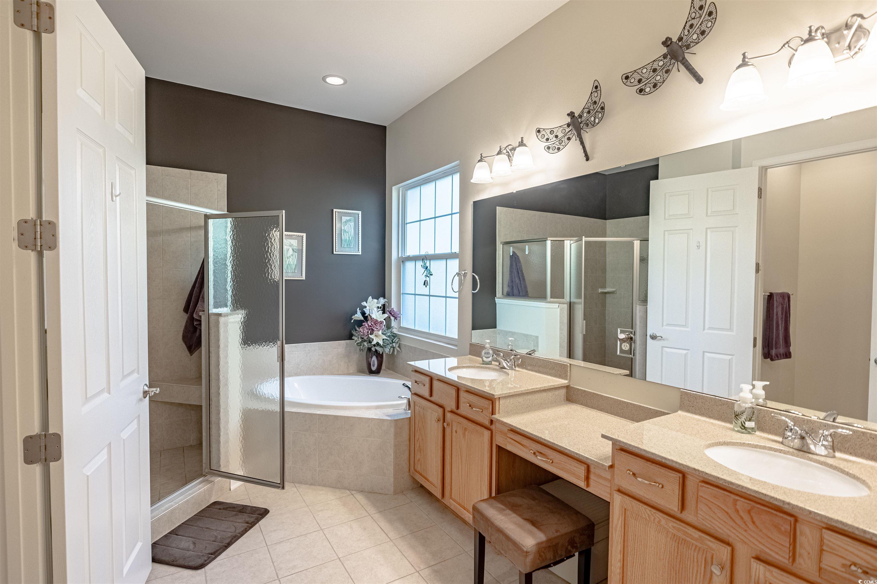 138 Sugar Loaf Lane Murrells Inlet, SC 29576 - Photo 27 of 38 Bathroom featuring plus walk in shower, vanity, an