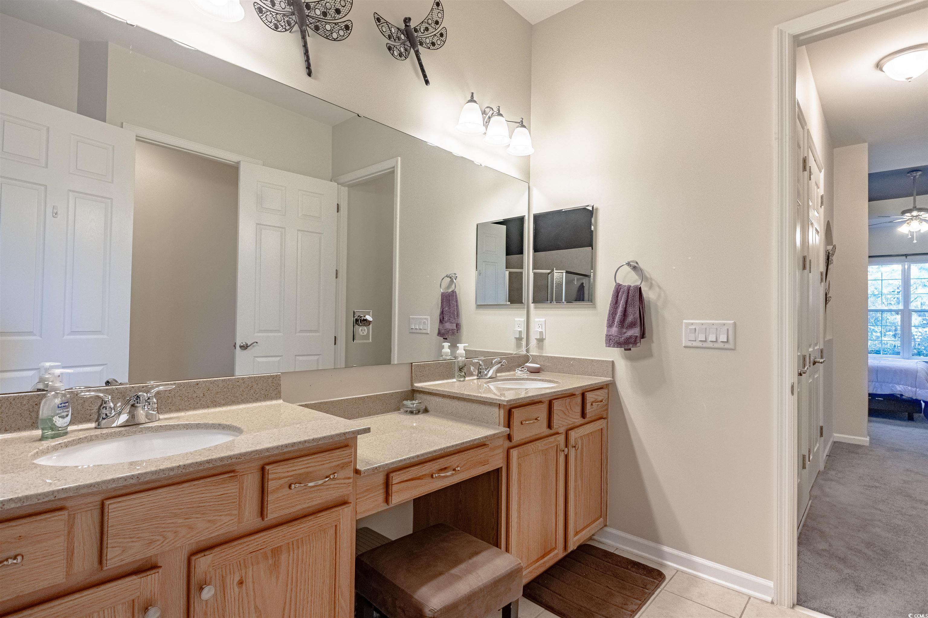 138 Sugar Loaf Lane Murrells Inlet, SC 29576 - Photo 28 of 38 Bathroom featuring tile patterned floors and vanit
