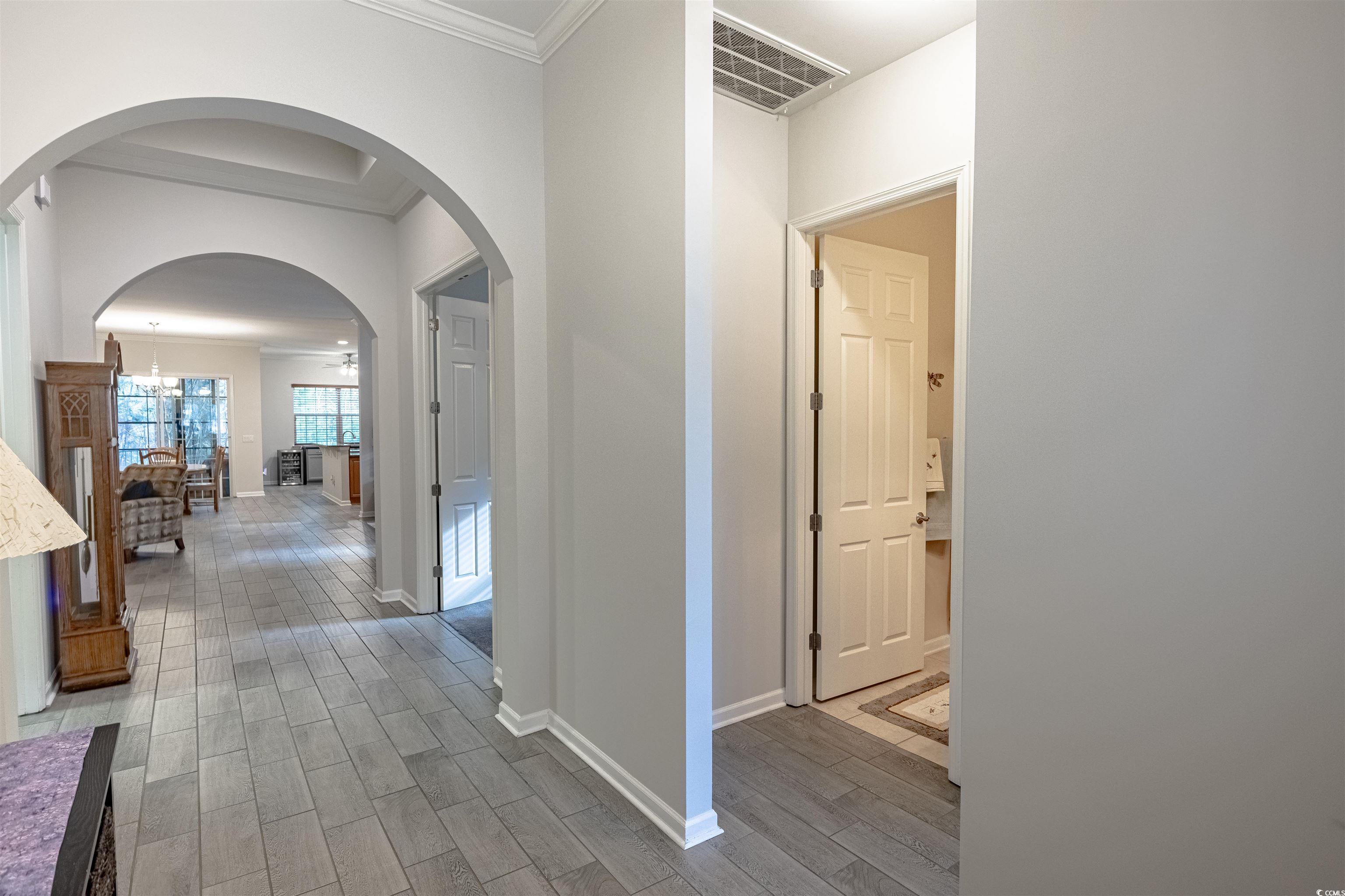 138 Sugar Loaf Lane Murrells Inlet, SC 29576 - Photo 7 of 38 Corridor with wood-type flooring, an inviting chan