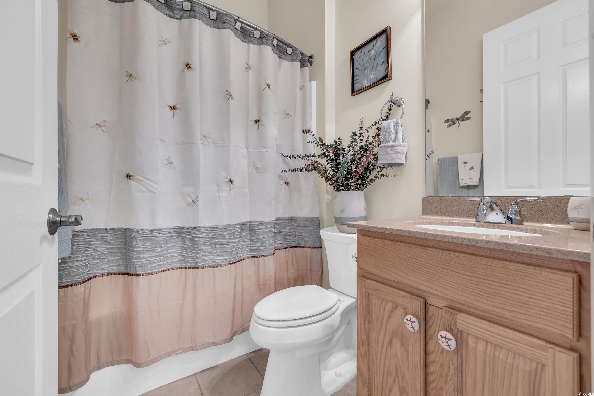 138 Sugar Loaf Lane Murrells Inlet, SC 29576 - Photo 9 of 38 Full bath featuring toilet, vanity, curtained show