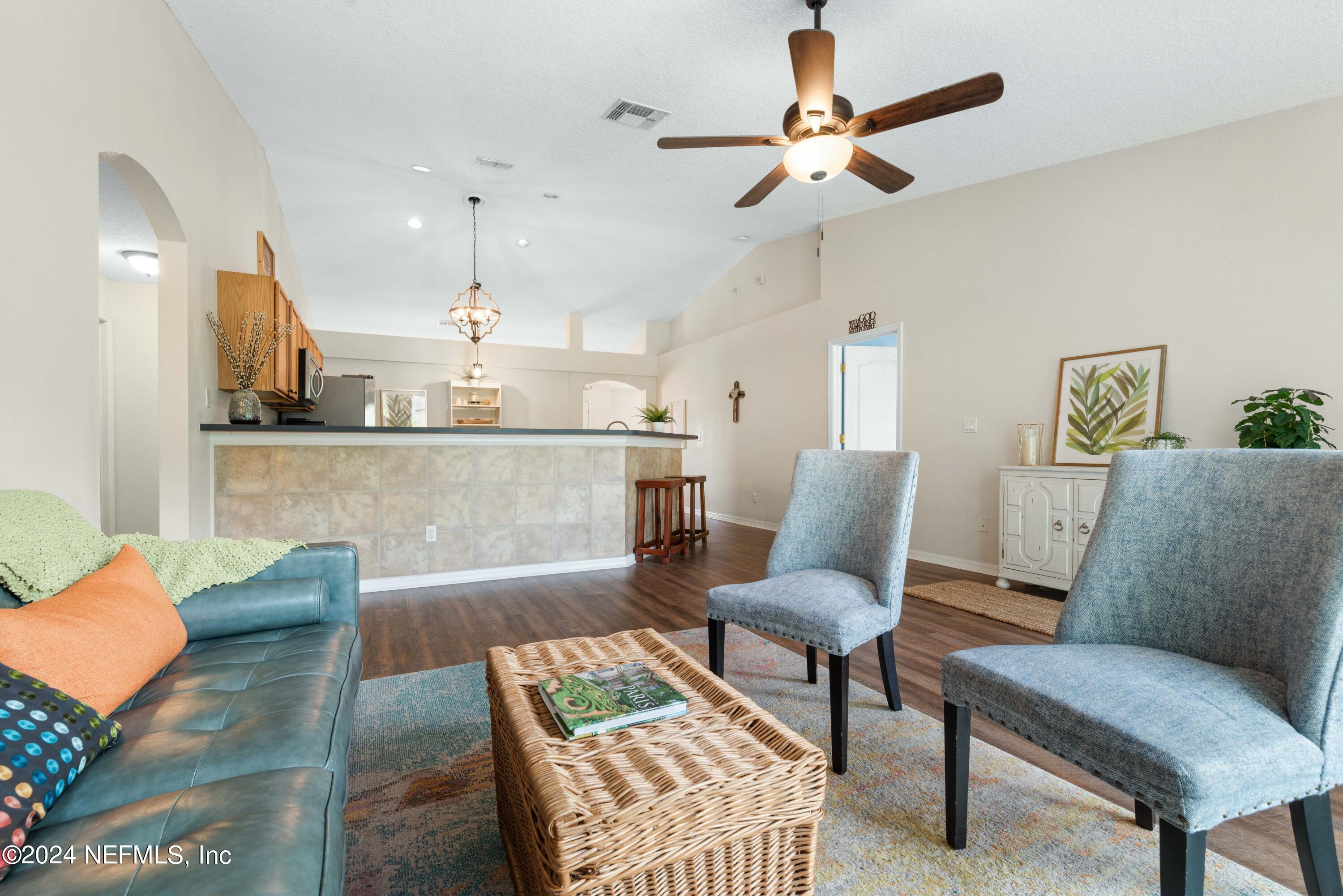 968 Deer Spring Drive Jacksonville, FL 32221 - Photo 15 of 31 a living room with furniture and a view of kitchen