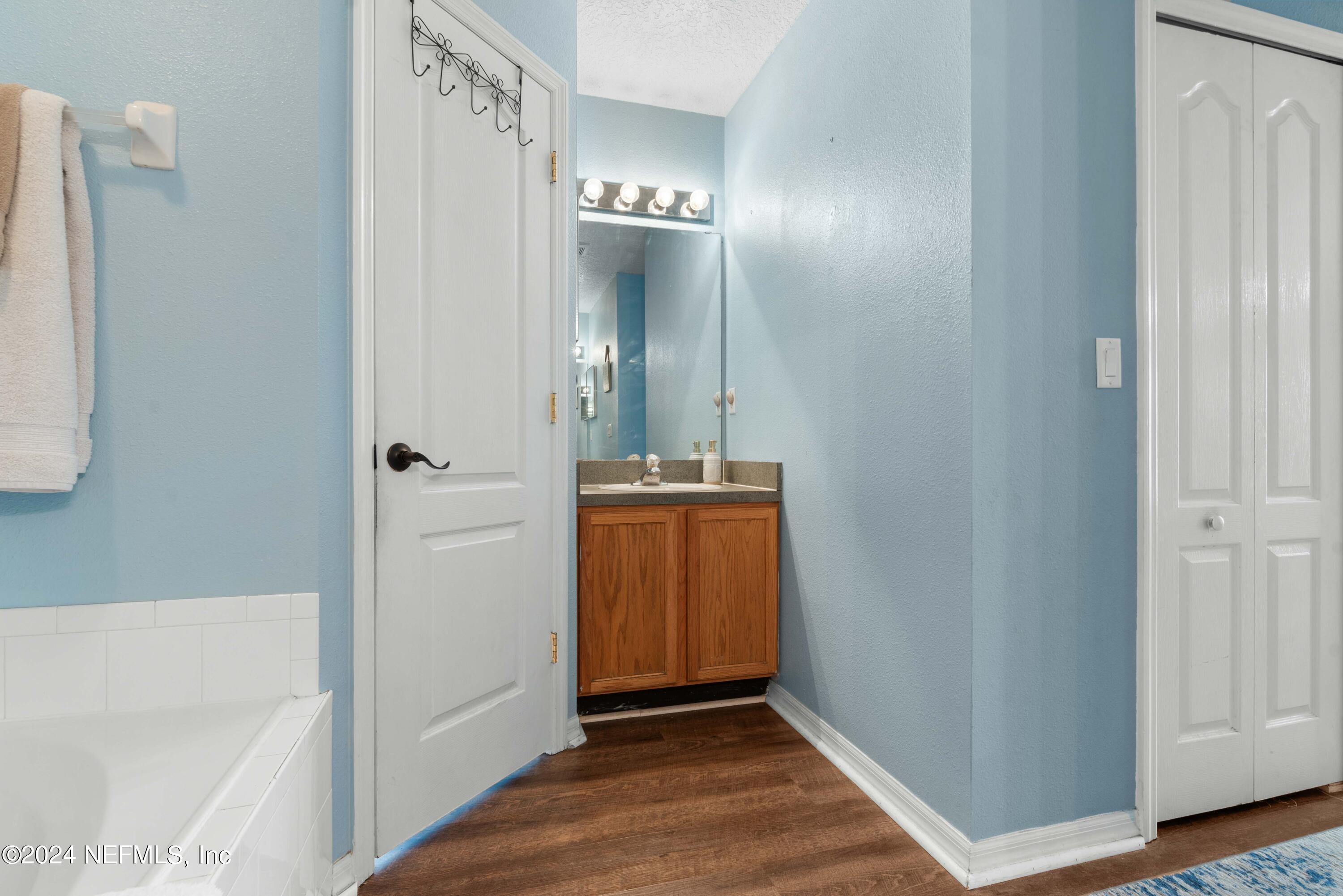 968 Deer Spring Drive Jacksonville, FL 32221 - Photo 19 of 31 a view of a hallway with wooden floor