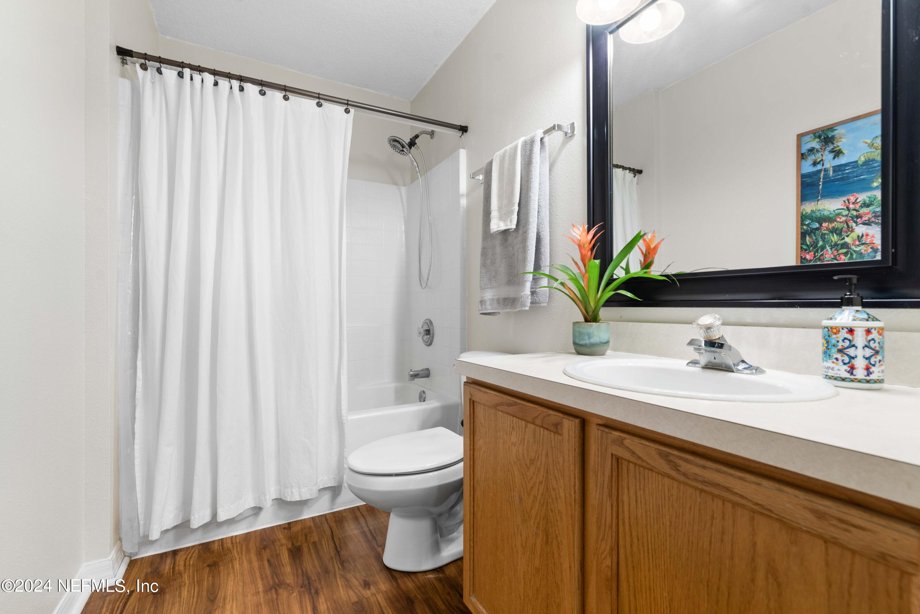 968 Deer Spring Drive Jacksonville, FL 32221 - Photo 22 of 31 a bathroom with a sink a toilet and a mirror