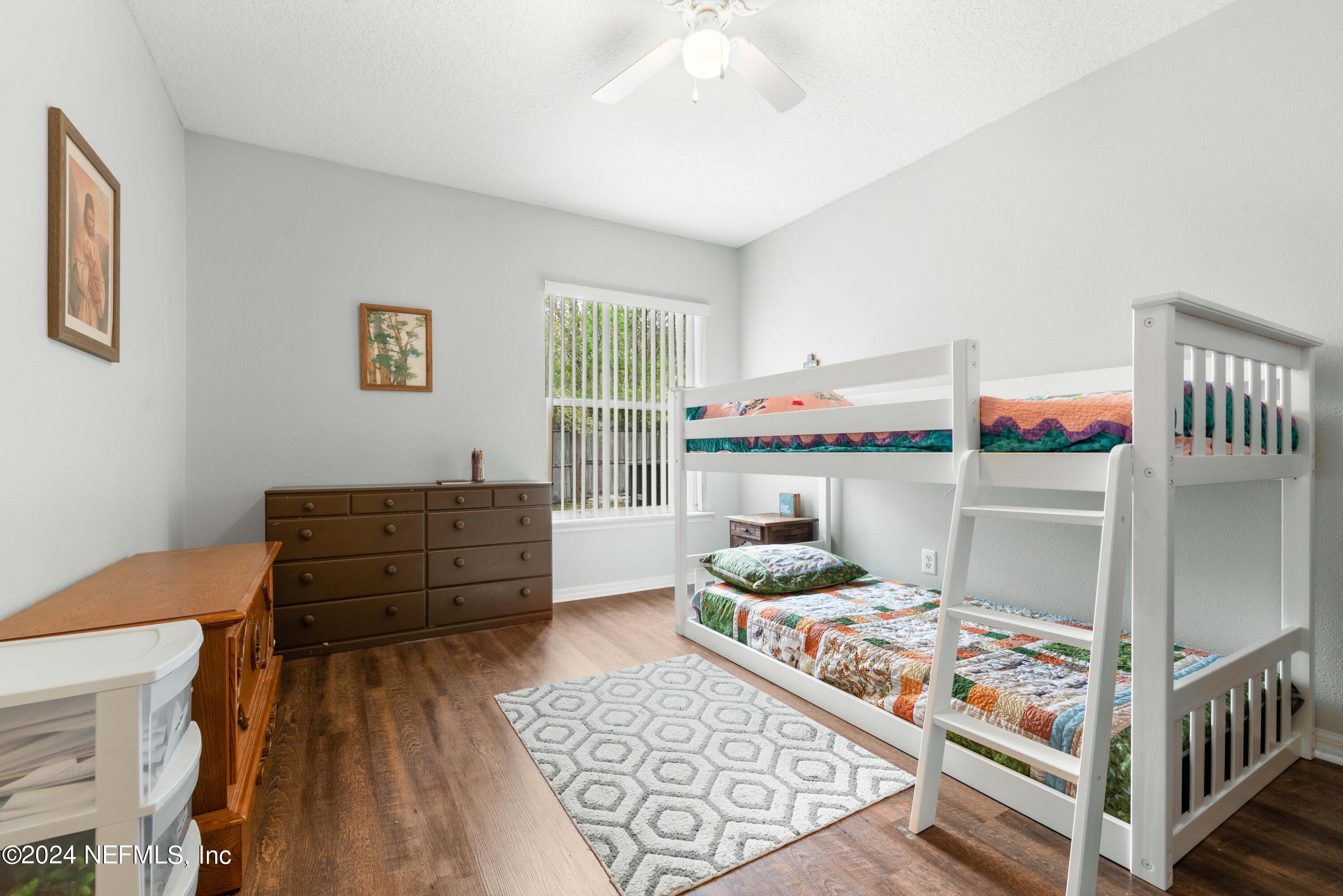 968 Deer Spring Drive Jacksonville, FL 32221 - Photo 23 of 31 a bed room with a bed and a window
