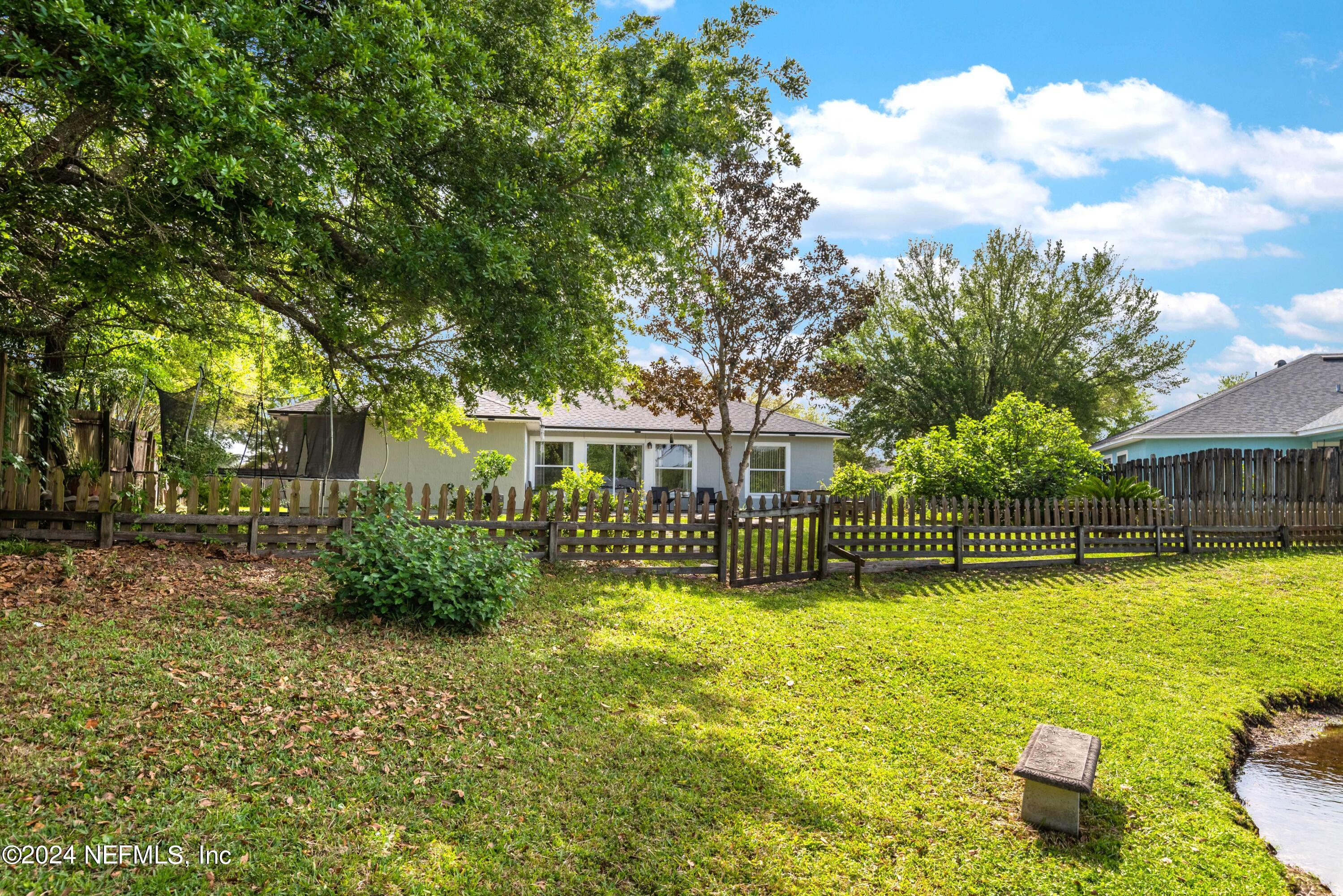 968 Deer Spring Drive Jacksonville, FL 32221 - Photo 24 of 31 a view of a swimming pool and lounge chair