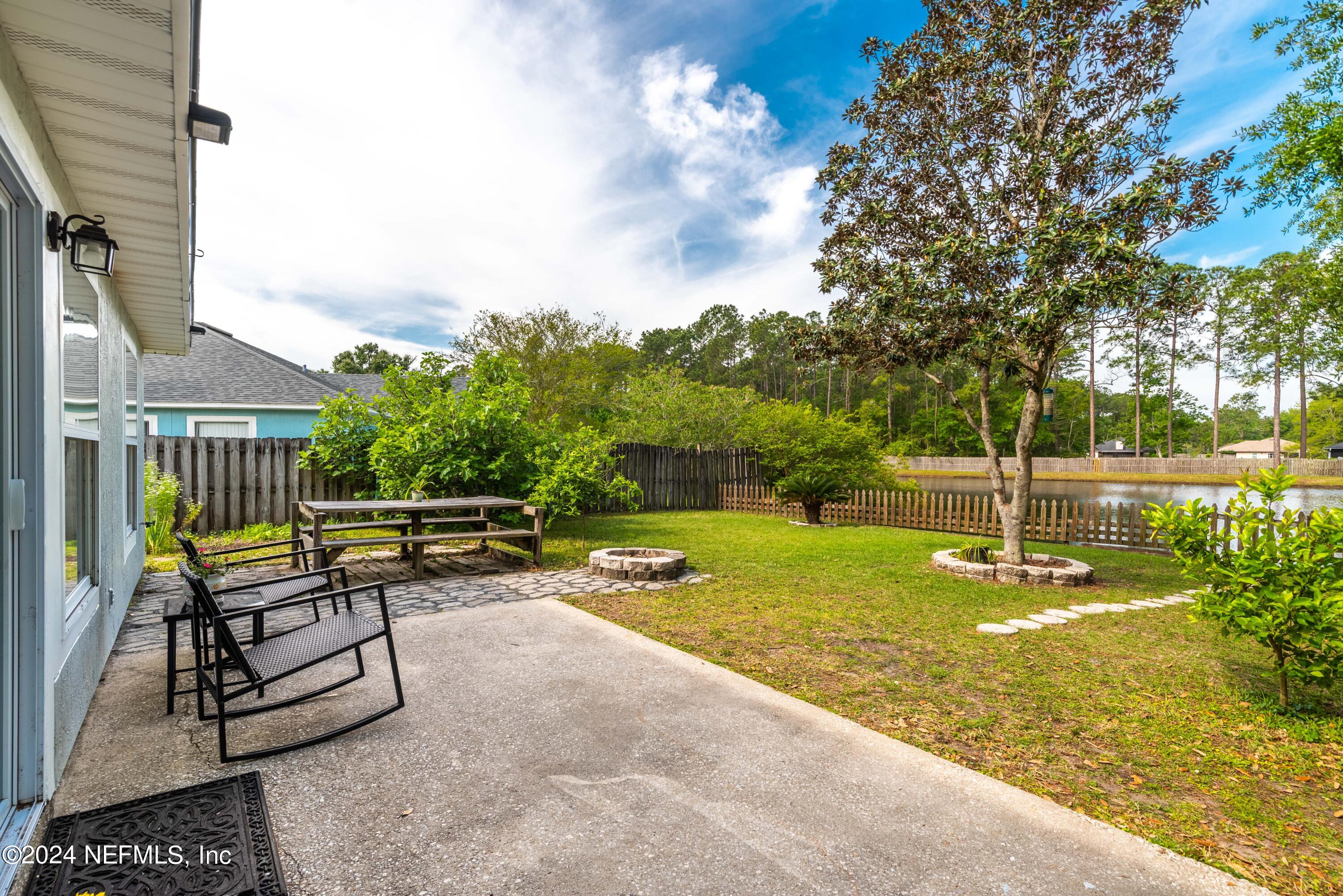 968 Deer Spring Drive Jacksonville, FL 32221 - Photo 28 of 31 a view of a bench in a backyard
