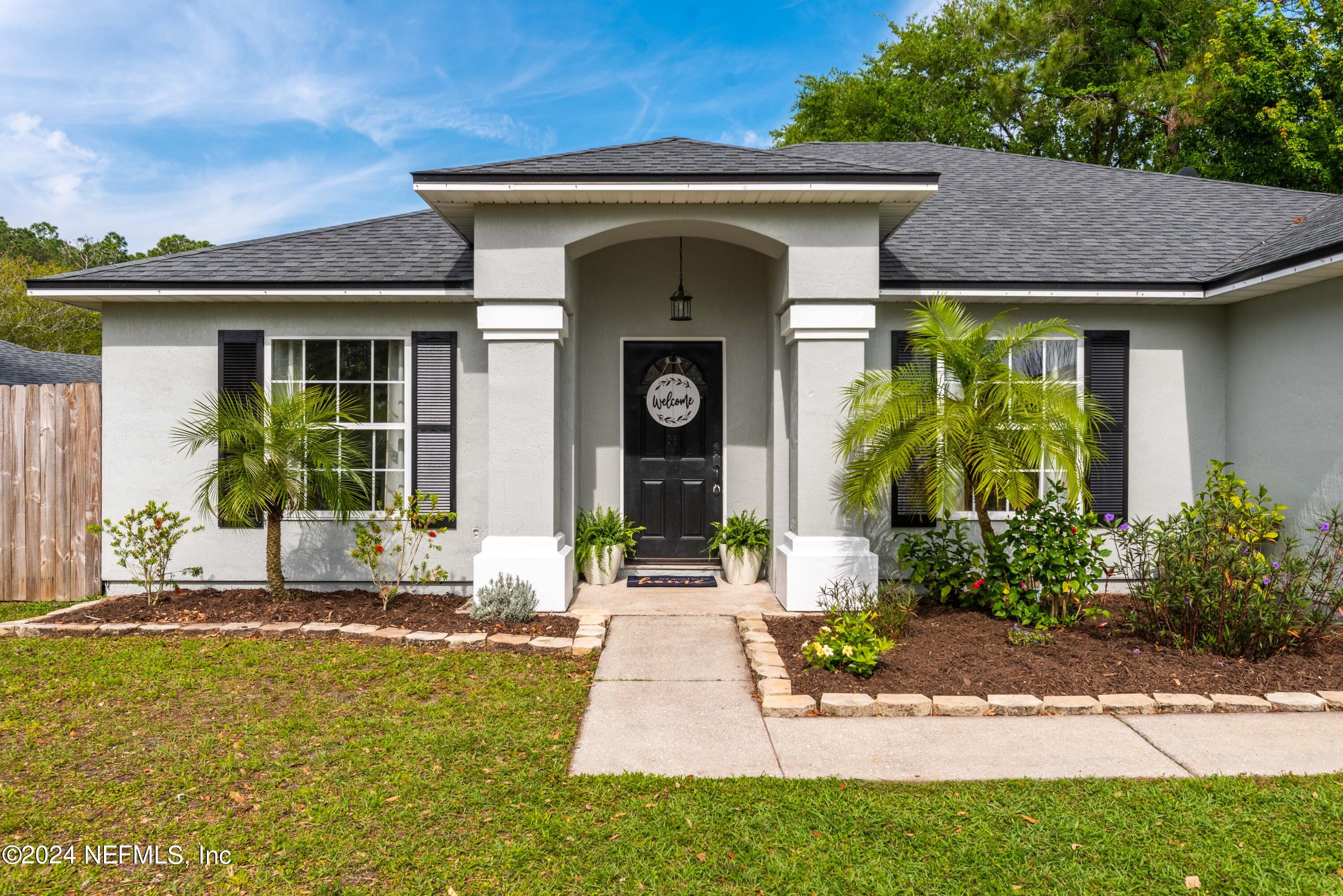 968 Deer Spring Drive Jacksonville, FL 32221 - Photo 30 of 31 a front view of a house with garden