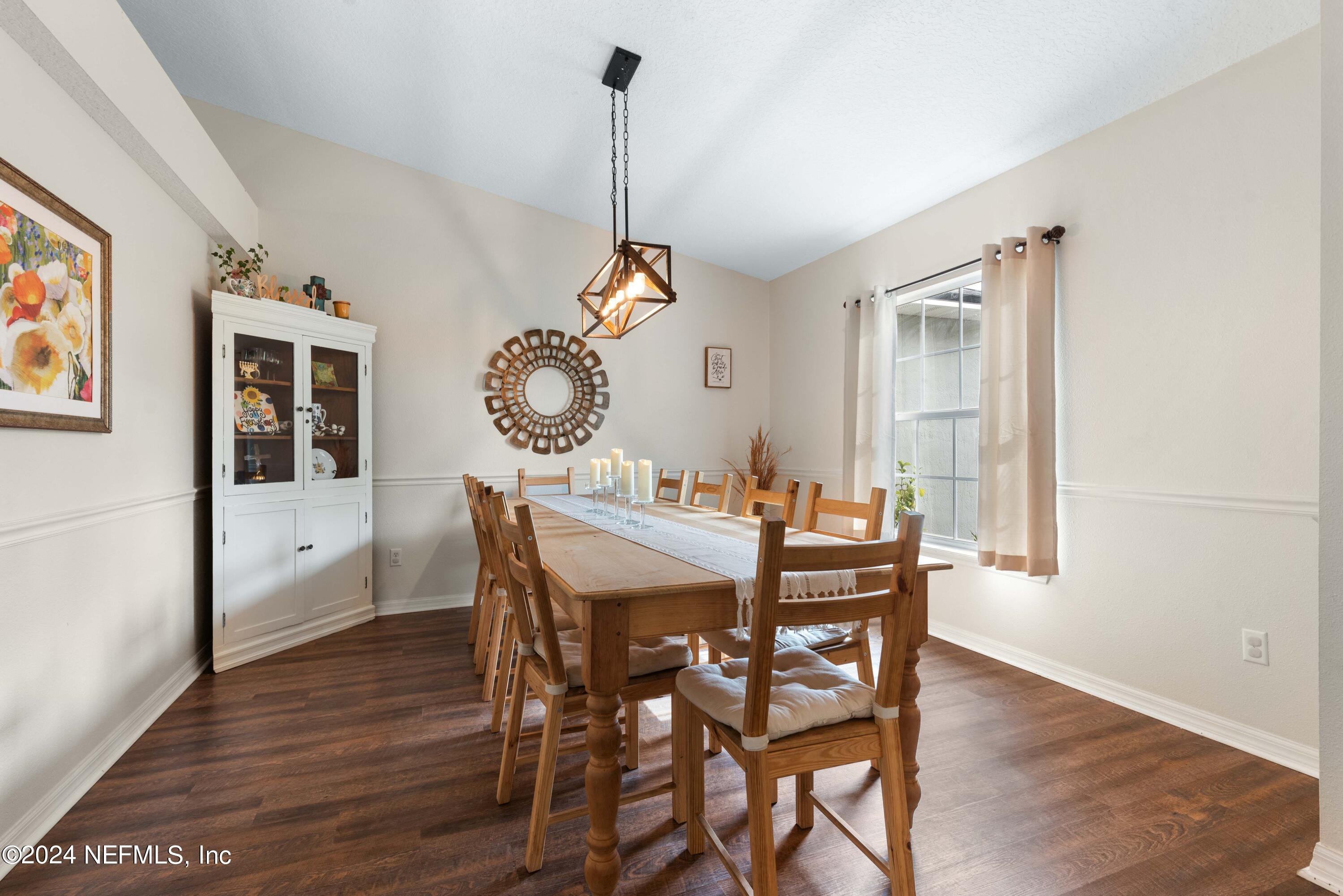 968 Deer Spring Drive Jacksonville, FL 32221 - Photo 3 of 31 a view of a dining room with furniture window and wooden floor