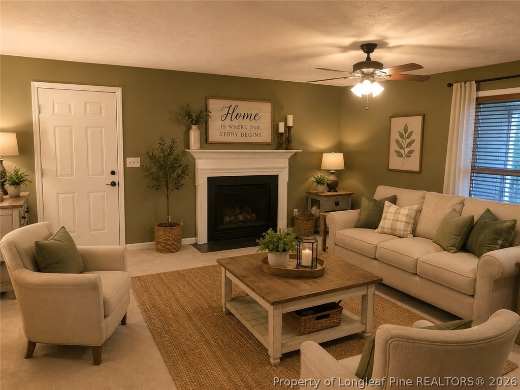 1833 Sardonyx Road, Unit 3 Fayetteville, NC 28303 - Photo 2 of 10 a living room with furniture and a fireplace